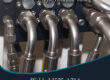Marmon Keystone Close-up view of metal hydraulic tubes connected to fittings, highlighting Marmon/Keystone as your trusted metals distributor for JIC hydraulic tubing—welded J525 A214—available in stock and ready to ship for your supplychain needs.